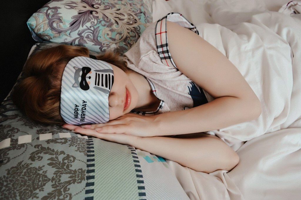 woman wearing a sleep mask